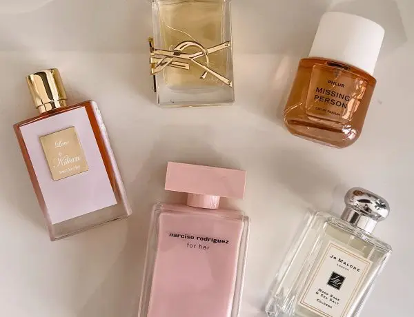 five perfumes laid out on table